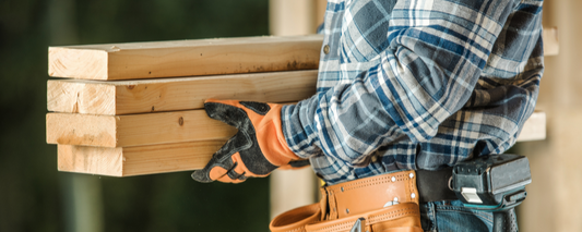 man carrying lumber - how to choose the right contractor