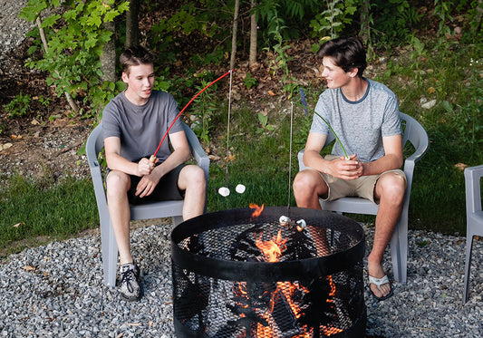 boys roasting marshmallows over the fire